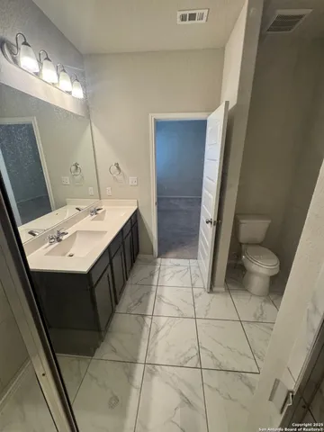 a bathroom with a sink and toilet