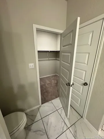 a bathroom with a sink mirror and shower