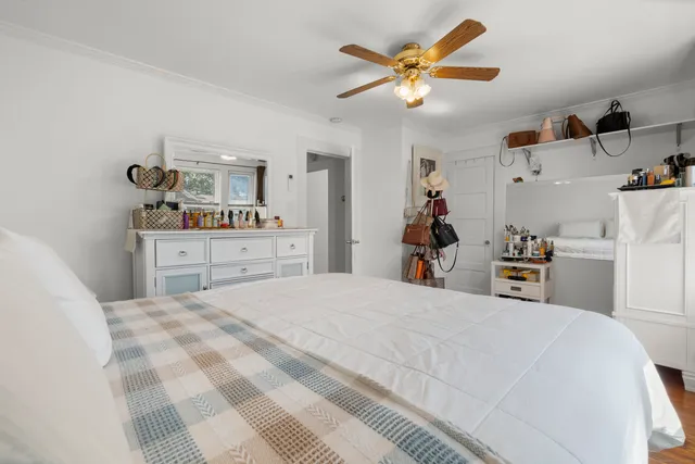 a bed room with a bed and a chandelier