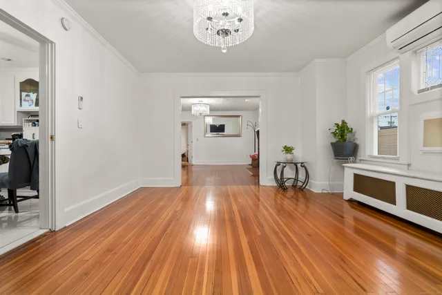 a view of a livingroom with furniture hardwood floor and a ceiling fan