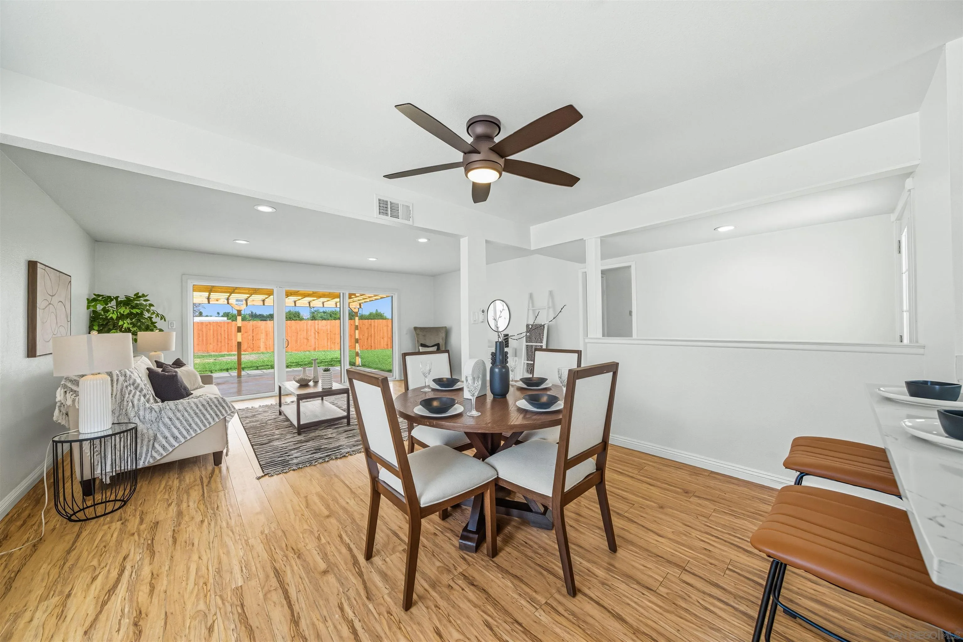 6221 Mead Court Riverside, CA 92504 - Photo 3 of 32 a dining room with furniture a window and wooden floor