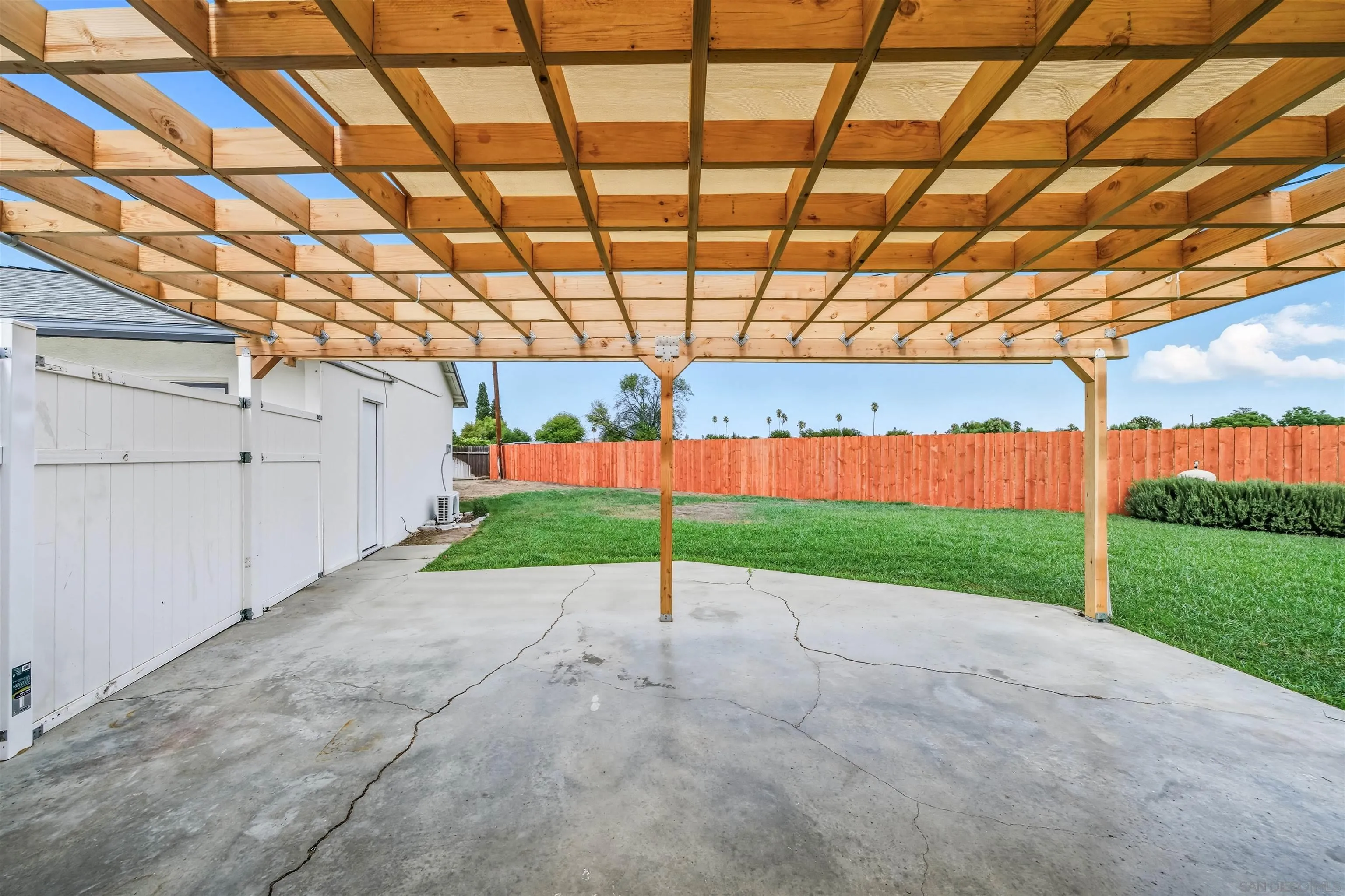 6221 Mead Court Riverside, CA 92504 - Photo 6 of 32 a view of a backyard with plants and garage