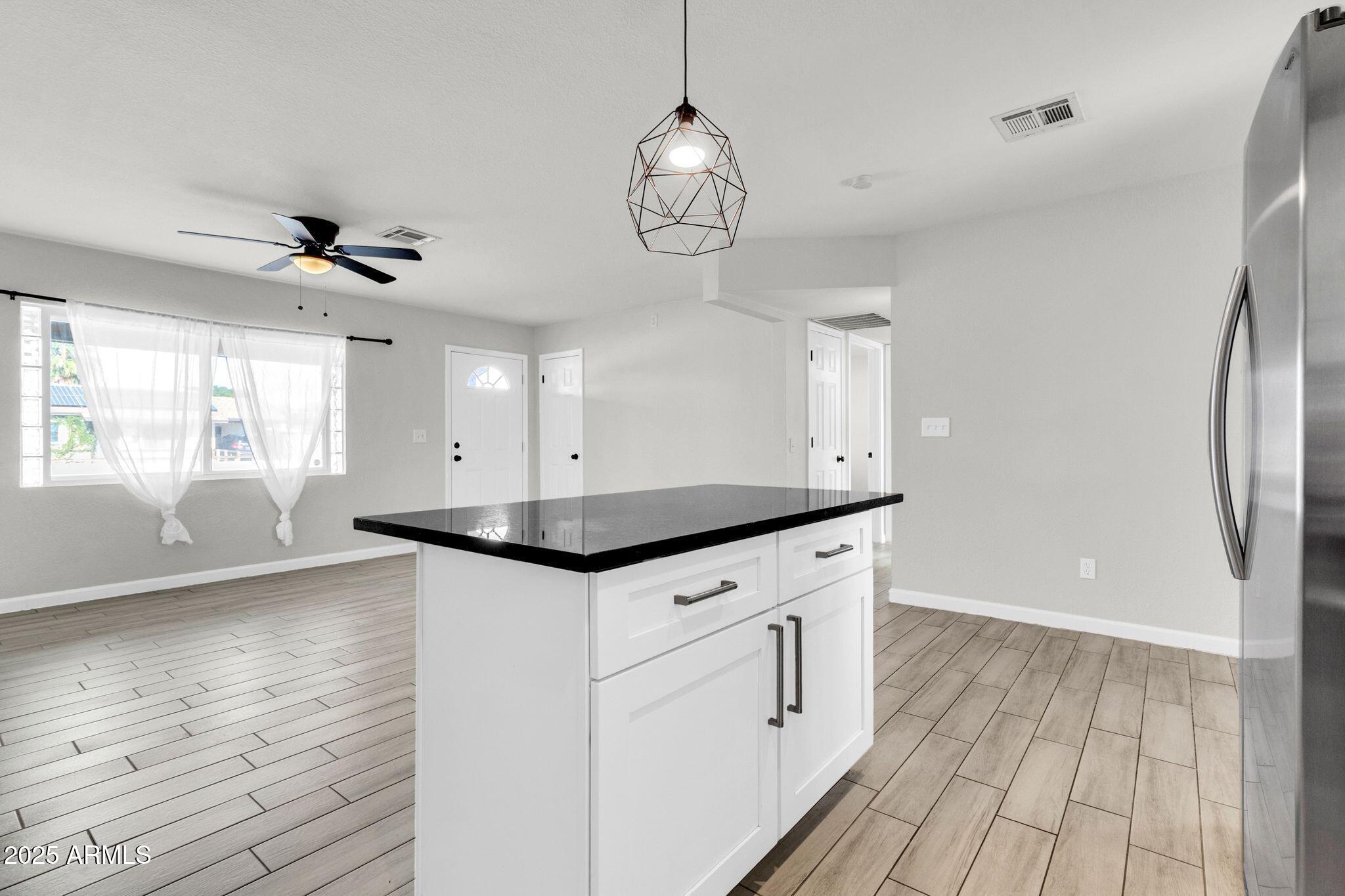449 East Harmony Avenue Mesa, AZ 85204 - Photo 11 of 30 a view of an entryway with wooden floor