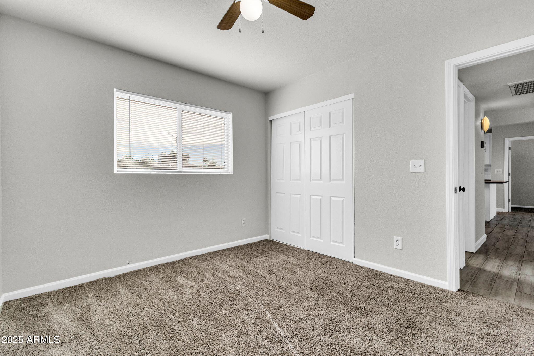 449 East Harmony Avenue Mesa, AZ 85204 - Photo 15 of 30 a view of an empty room with a window