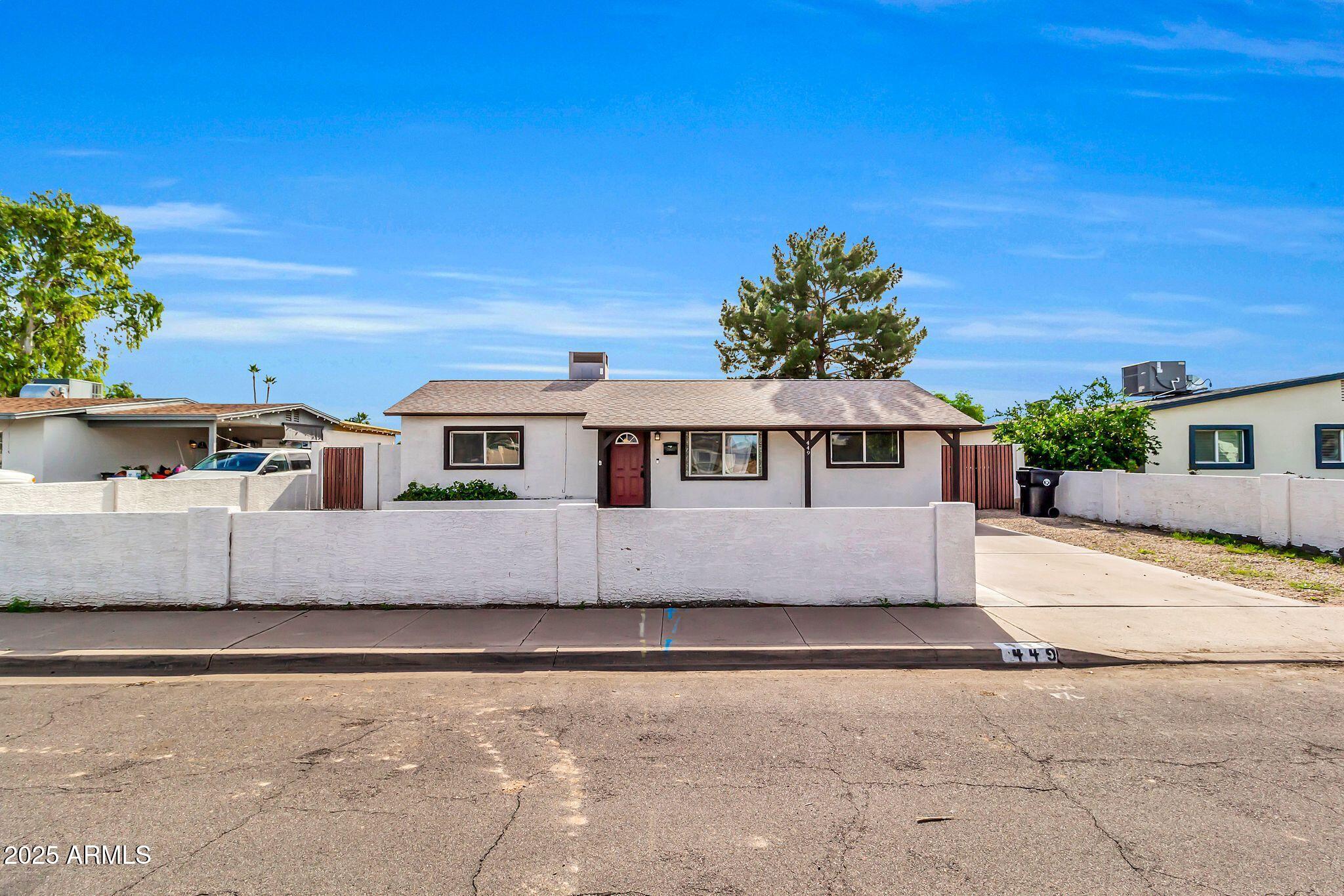 449 East Harmony Avenue Mesa, AZ 85204 - Photo 2 of 30 a front view of a house with a yard
