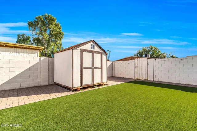 a view of backyard with a garden and stairs