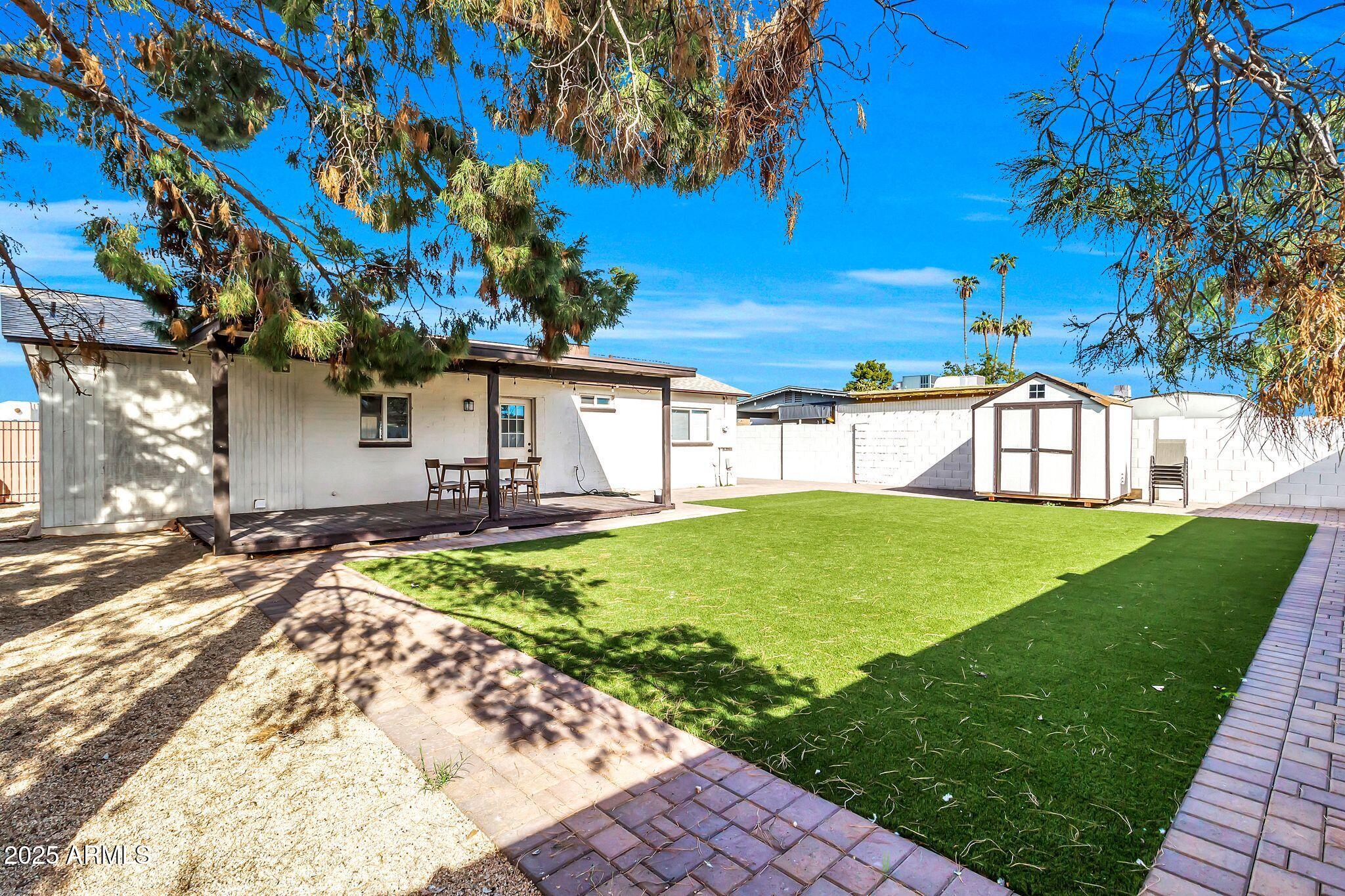 449 East Harmony Avenue Mesa, AZ 85204 - Photo 25 of 30 a view of a house with a backyard