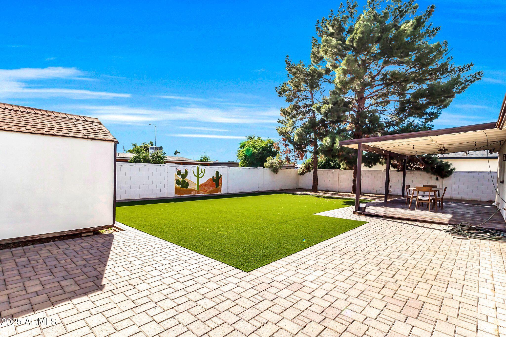 449 East Harmony Avenue Mesa, AZ 85204 - Photo 27 of 30 a view of a patio with a table and chairs