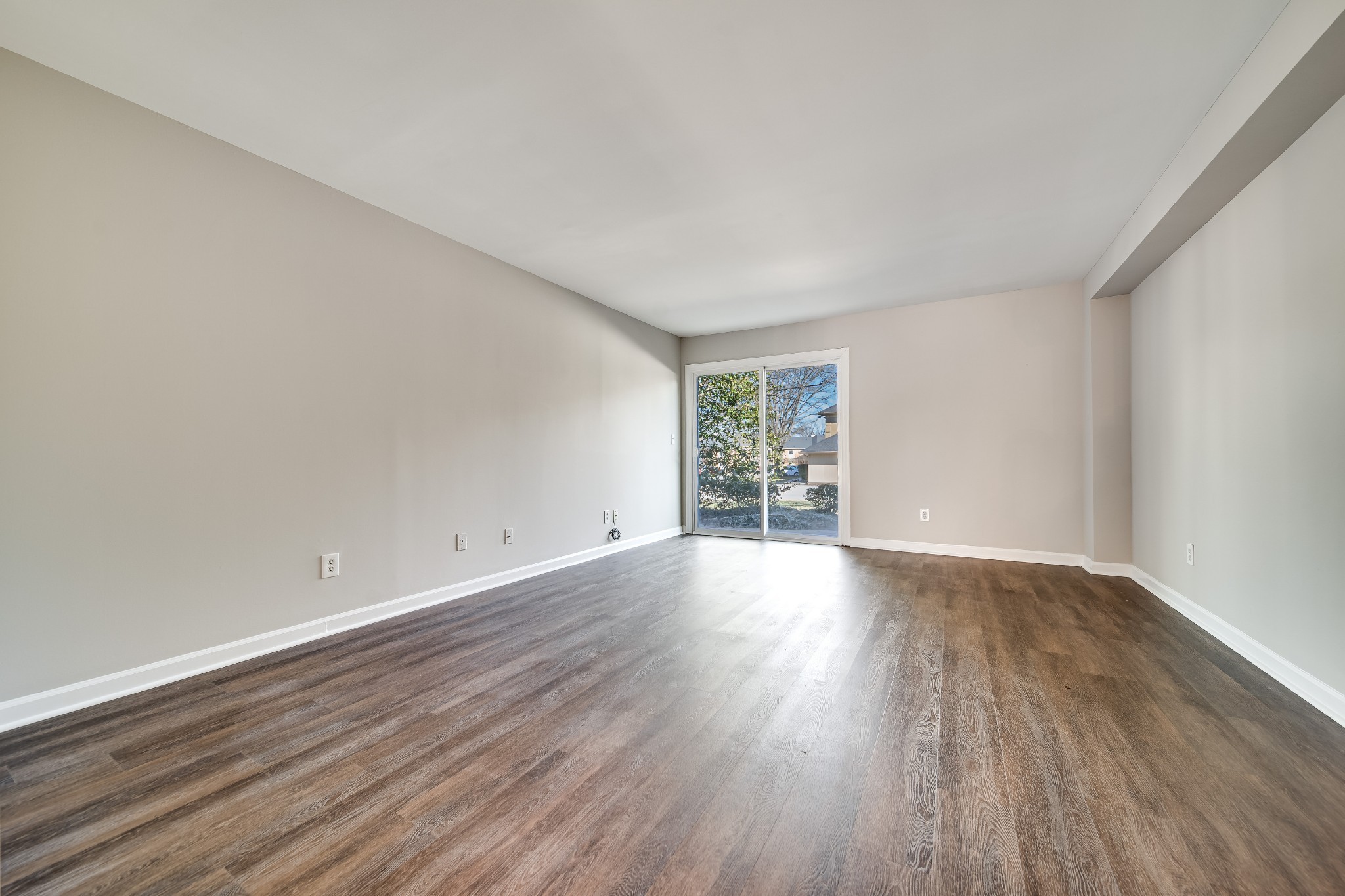 4487 Post Place, Unit 165 Nashville, TN 37205 - Photo 12 of 41 a view of an empty room with wooden floor and a window