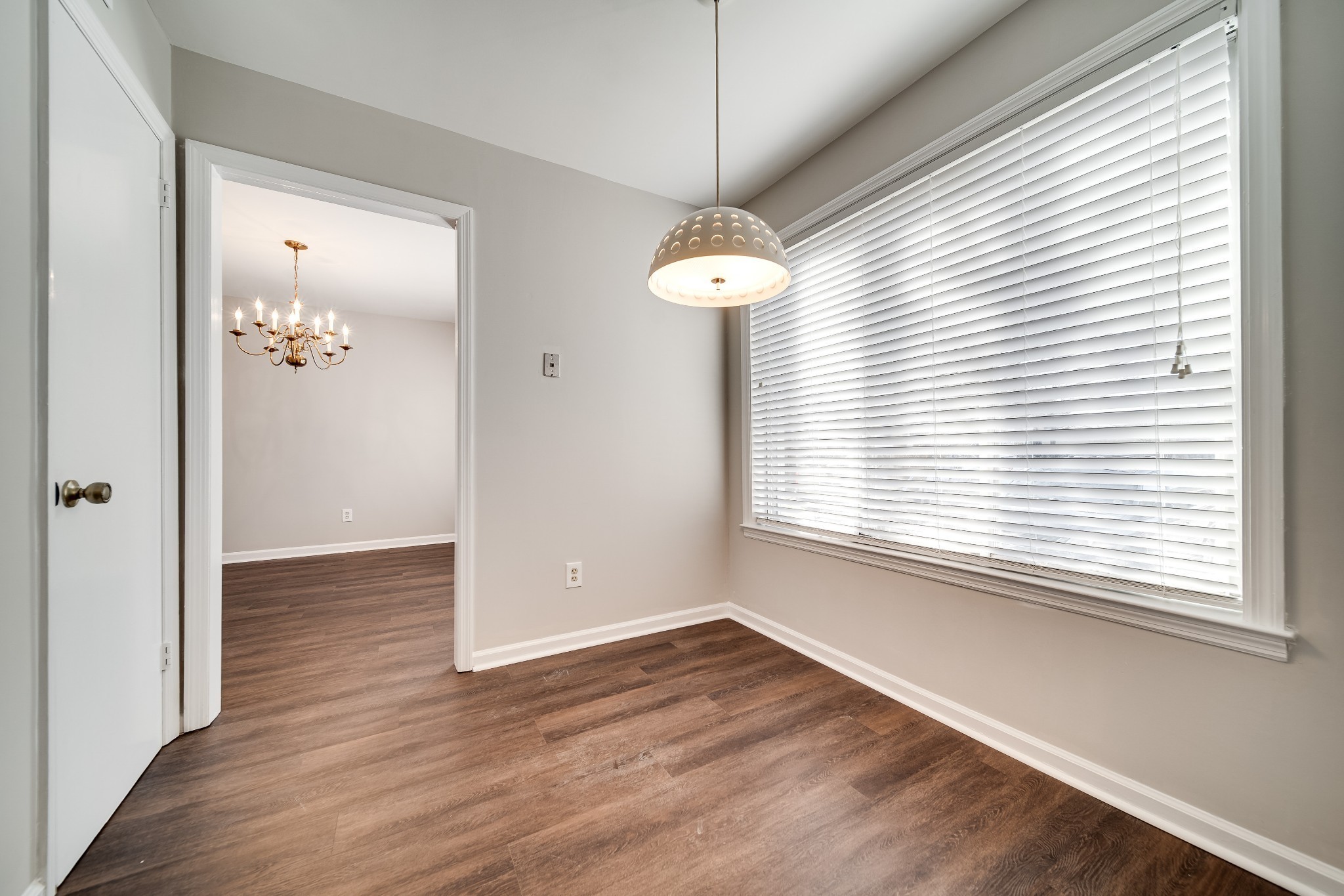 4487 Post Place, Unit 165 Nashville, TN 37205 - Photo 20 of 41 an empty room with wooden floor and windows