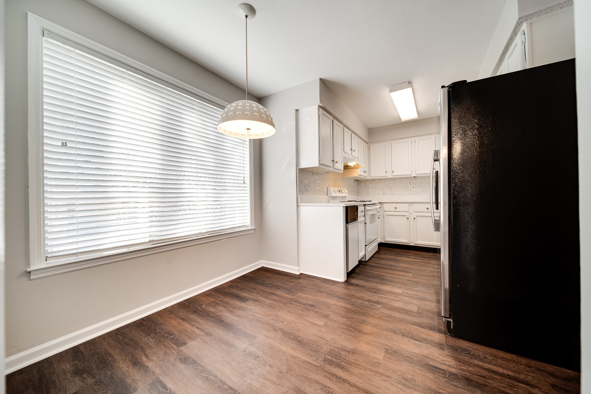 4487 Post Place, Unit 165 Nashville, TN 37205 - Photo 21 of 41 a kitchen with stainless steel appliances granite countertop a refrigerator and a stove top oven
