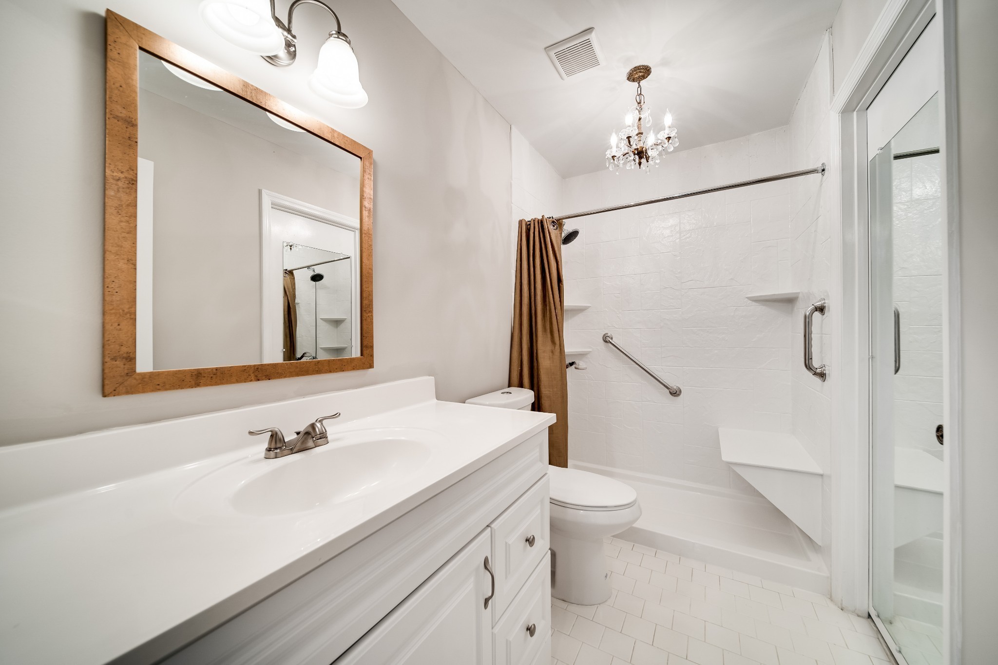 4487 Post Place, Unit 165 Nashville, TN 37205 - Photo 29 of 41 a bathroom with a sink a toilet and a mirror
