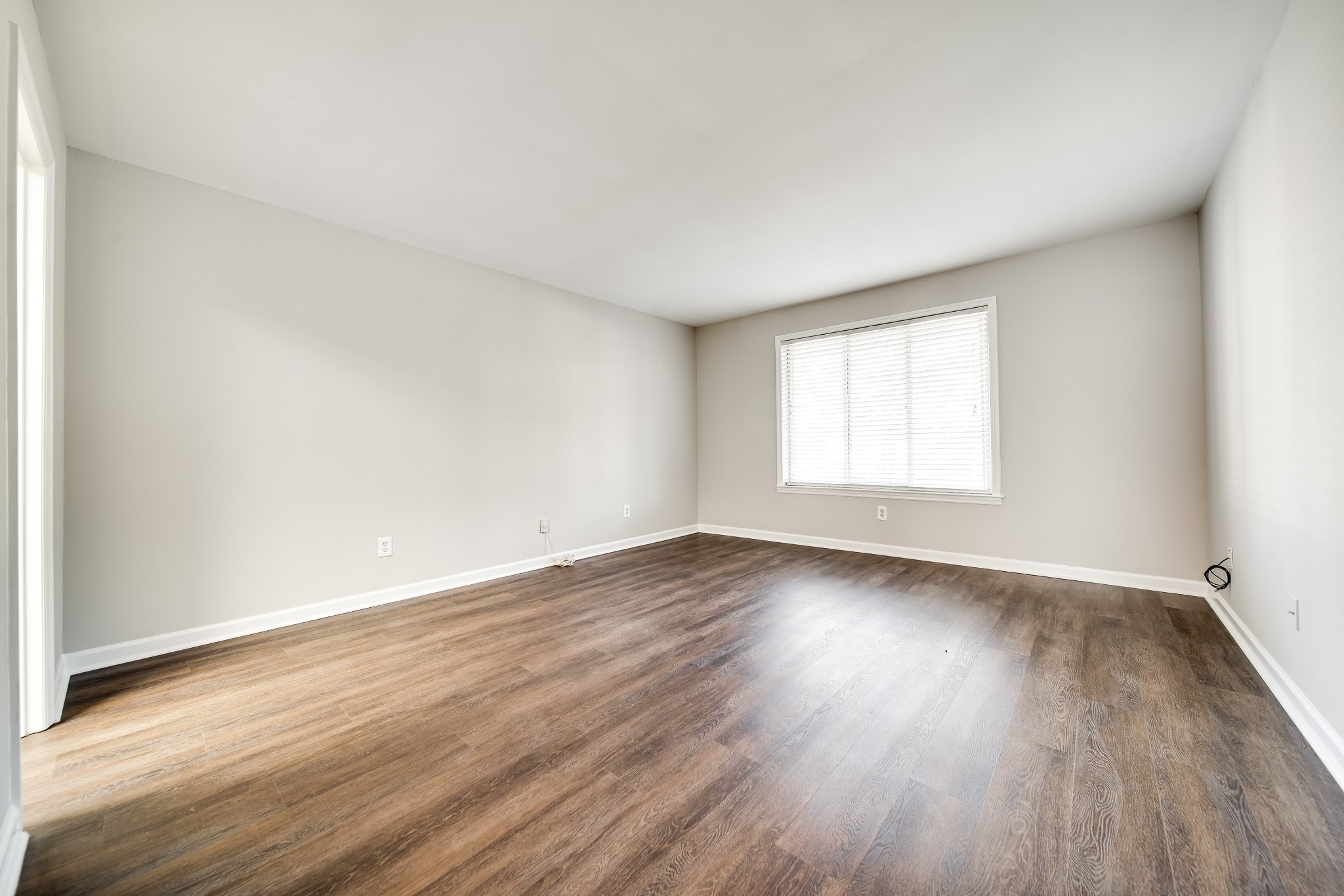 4487 Post Place, Unit 165 Nashville, TN 37205 - Photo 32 of 41 an empty room with wooden floor and window