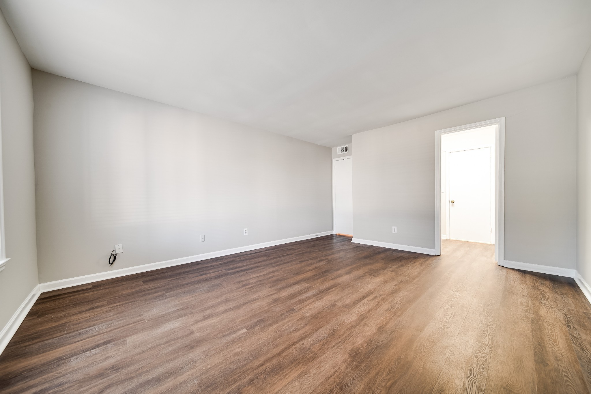 4487 Post Place, Unit 165 Nashville, TN 37205 - Photo 33 of 41 a view of an empty room with wooden floor