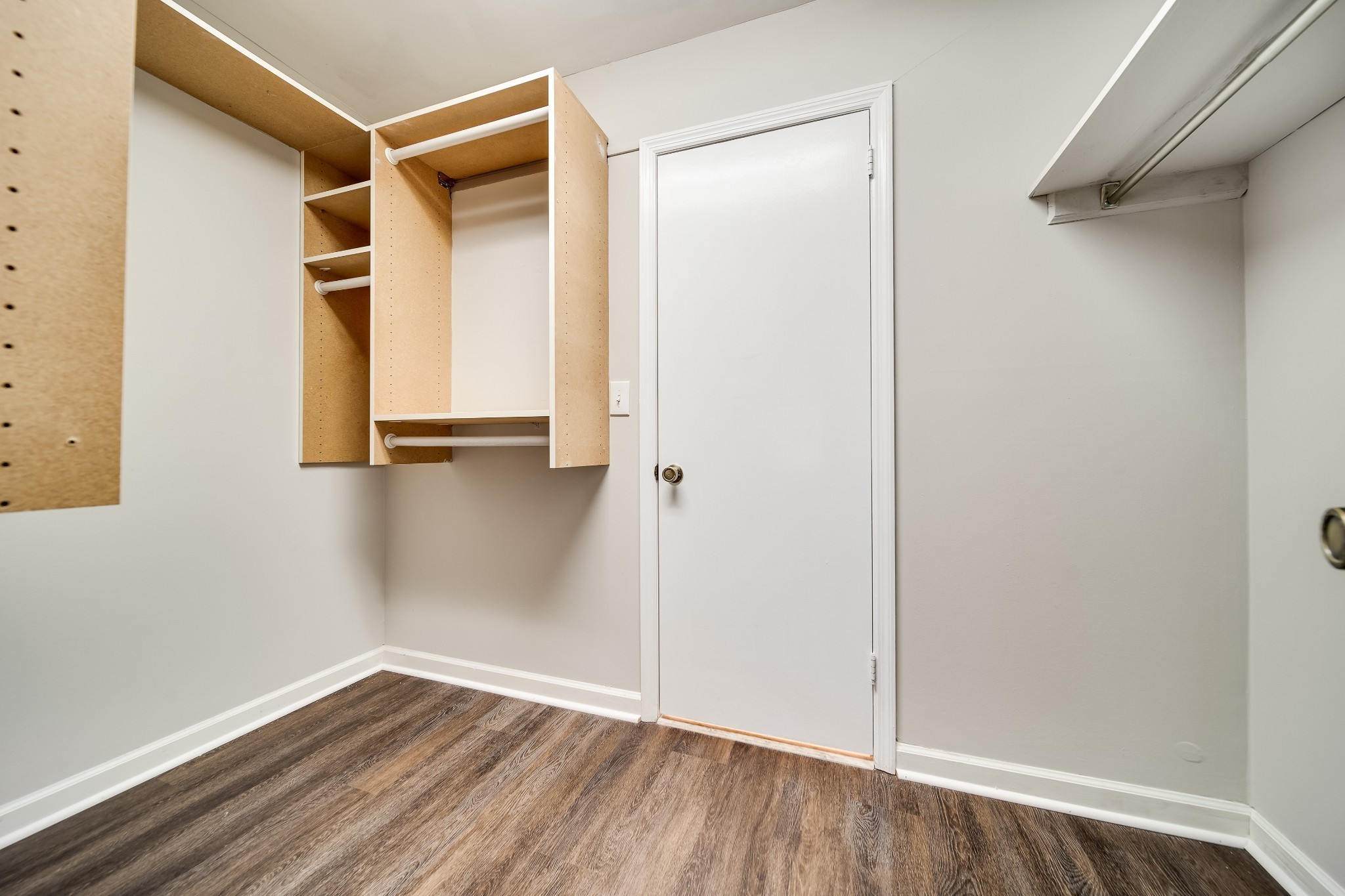4487 Post Place, Unit 165 Nashville, TN 37205 - Photo 34 of 41 a view of an empty room with wooden floor and closet