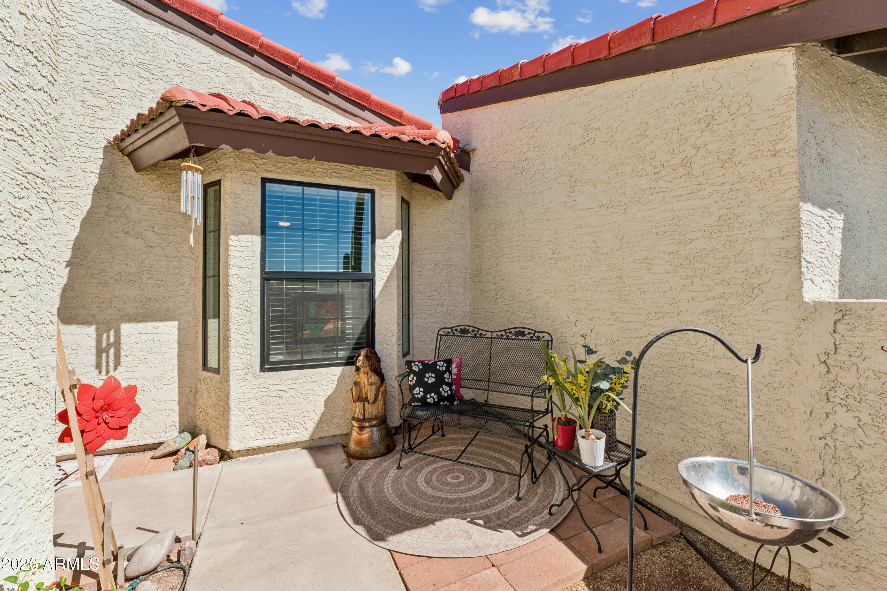 6027 South Alameda Road Gold Canyon, AZ 85118 - Photo 5 of 27 a backyard of a house with table and chairs