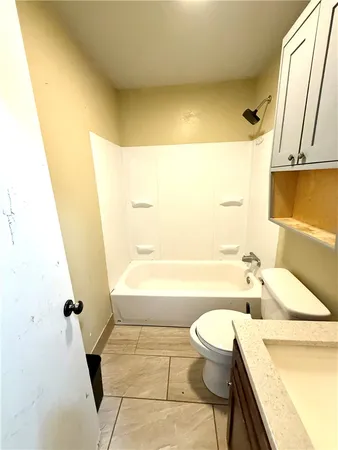 a bathroom with a sink a toilet and a bathtub
