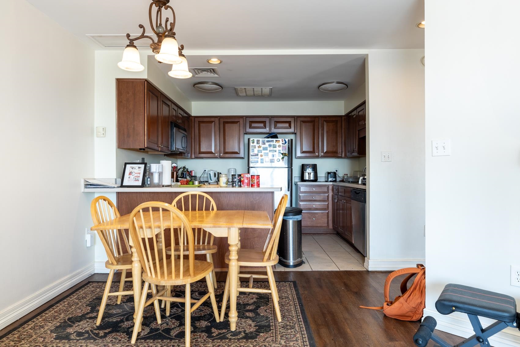 655 Riverside Drive, Unit 1008A Memphis, TN 38103 - Photo 7 of 10 Kitchen featuring light wood-style flooring, light countertops, stainless steel appliances, and a peninsula