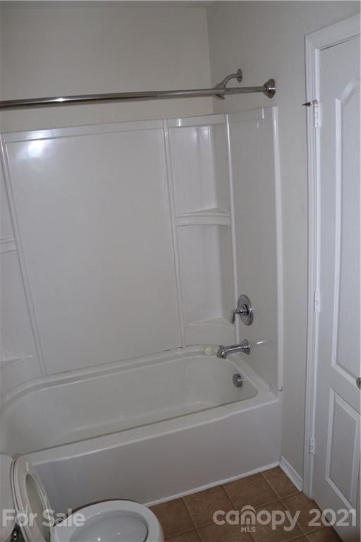 718 Elders Story Road Fort Mill, SC 29708 - Photo 9 of 13 a bathroom with a bathtub and a shower