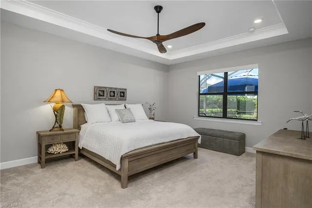 a bed sitting in a room next to a window