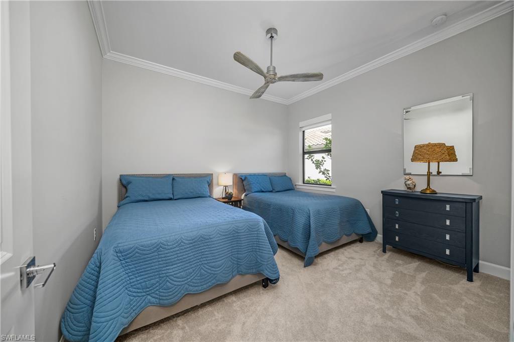 17574 Ashcomb Way Estero, FL 33928 - Photo 18 of 32 a bedroom with two beds and a dresser