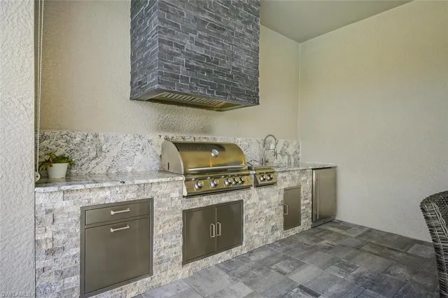a kitchen with a stove and cabinets