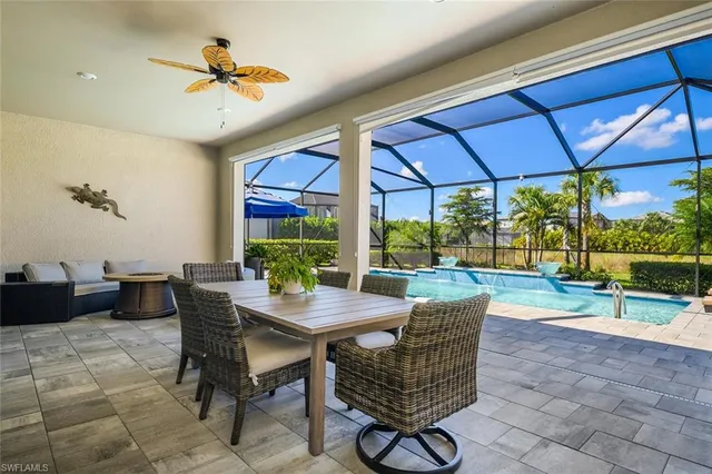 a view of a patio with a table and chairs