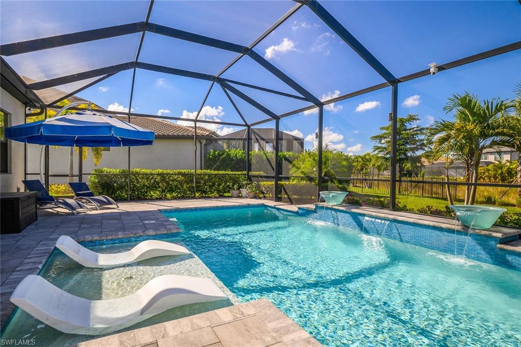 17574 Ashcomb Way Estero, FL 33928 - Photo 25 of 32 a view of a backyard with swimming pool