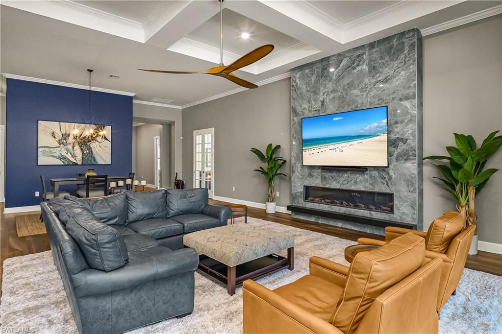 17574 Ashcomb Way Estero, FL 33928 - Photo 3 of 32 a living room with furniture and a flat screen tv
