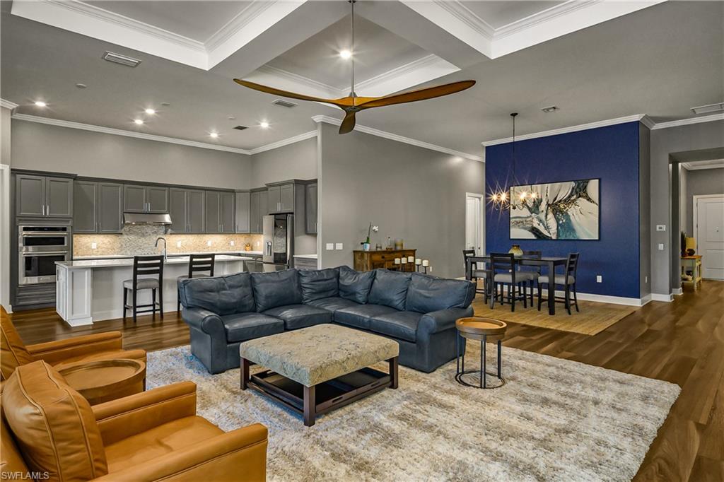 17574 Ashcomb Way Estero, FL 33928 - Photo 4 of 32 a living room with furniture and a flat screen tv