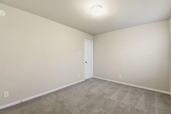 an empty room with a empty space and window