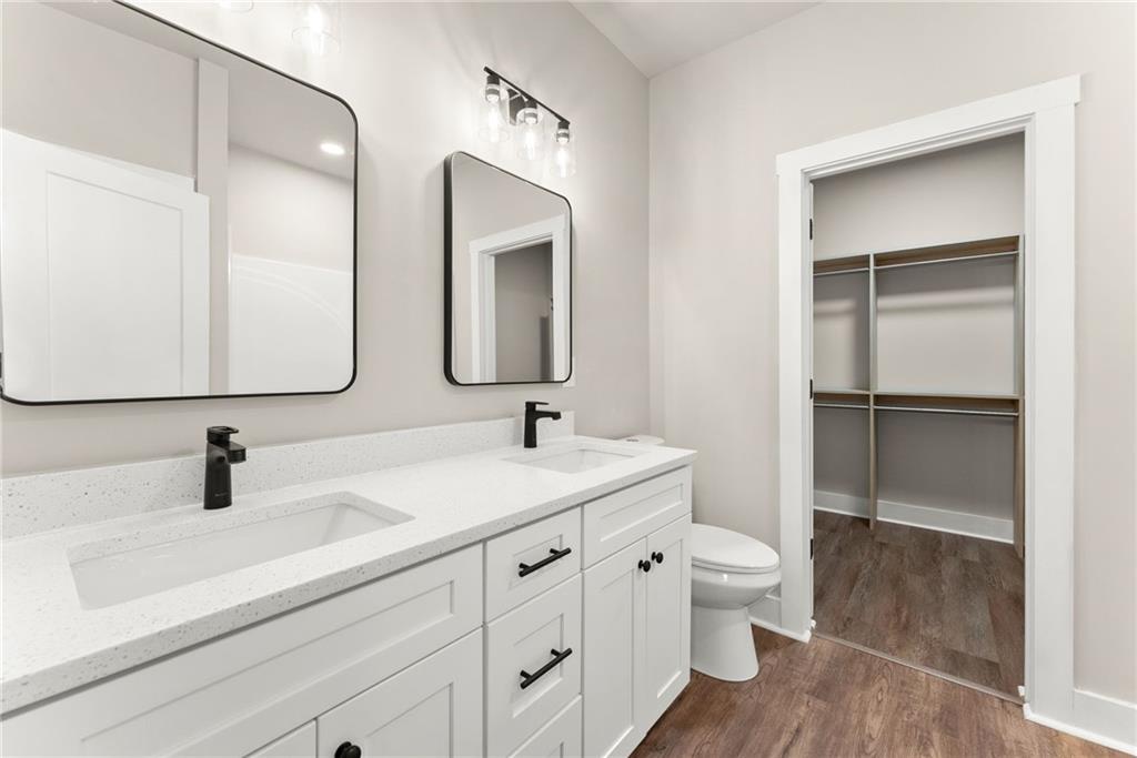 43 Anderson Street Jefferson, GA 30549 - Photo 20 of 45 a bathroom with a sink a toilet and a mirror