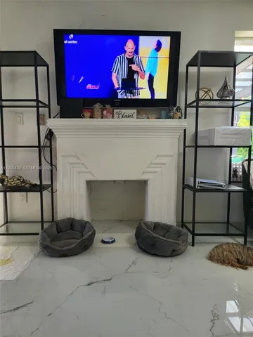 a view of fireplace and living room with a fireplace