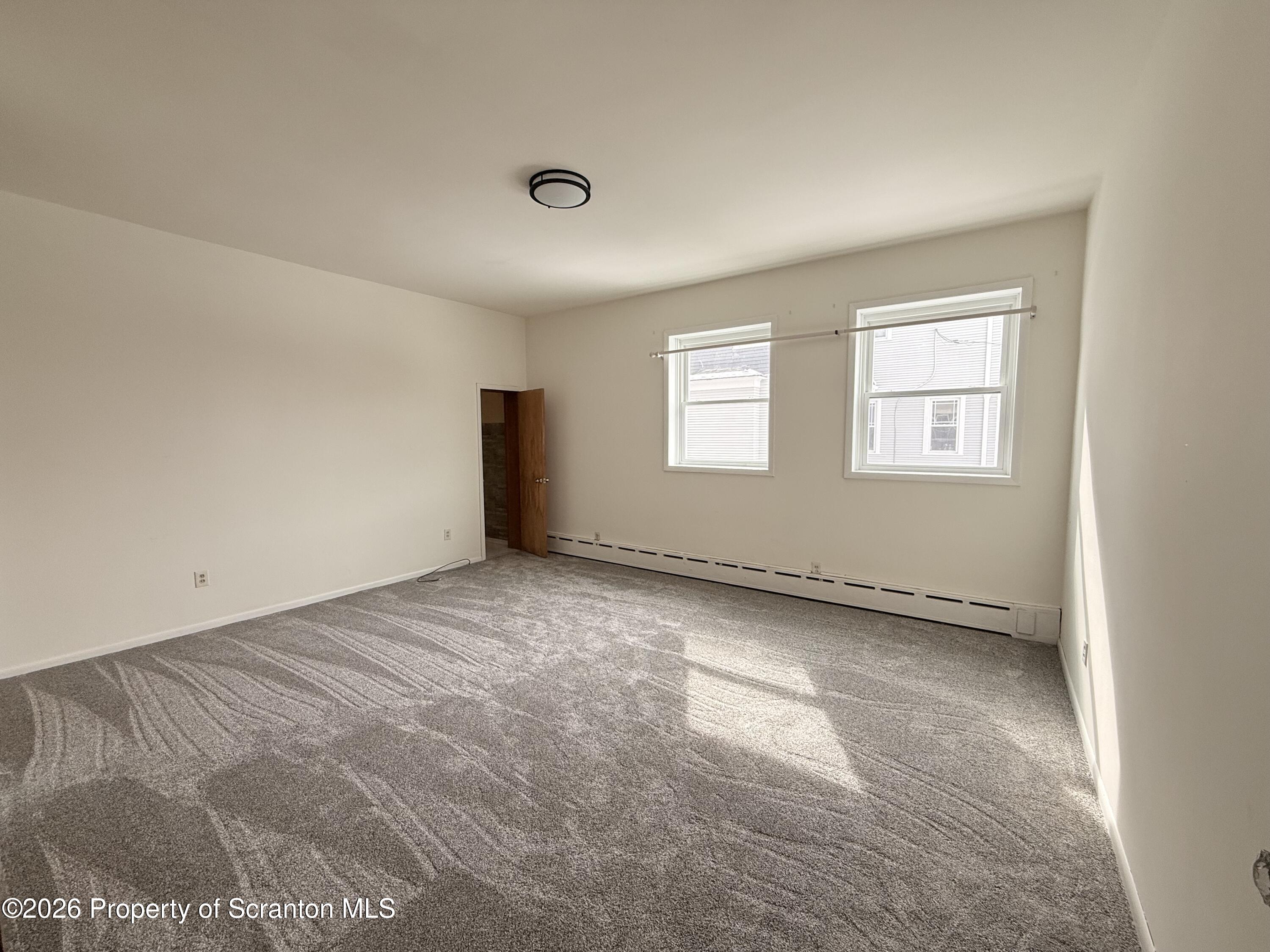 629 Clay Avenue, Unit 1 Scranton, PA 18510 - Photo 12 of 15 an empty room with windows