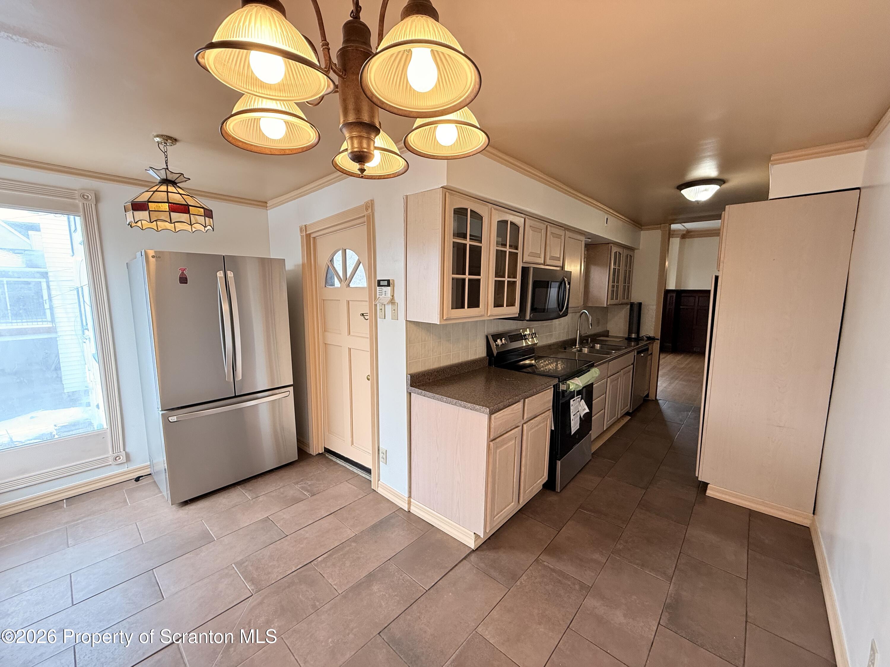 629 Clay Avenue, Unit 1 Scranton, PA 18510 - Photo 8 of 15 a kitchen with stainless steel appliances granite countertop a refrigerator a stove and a sink