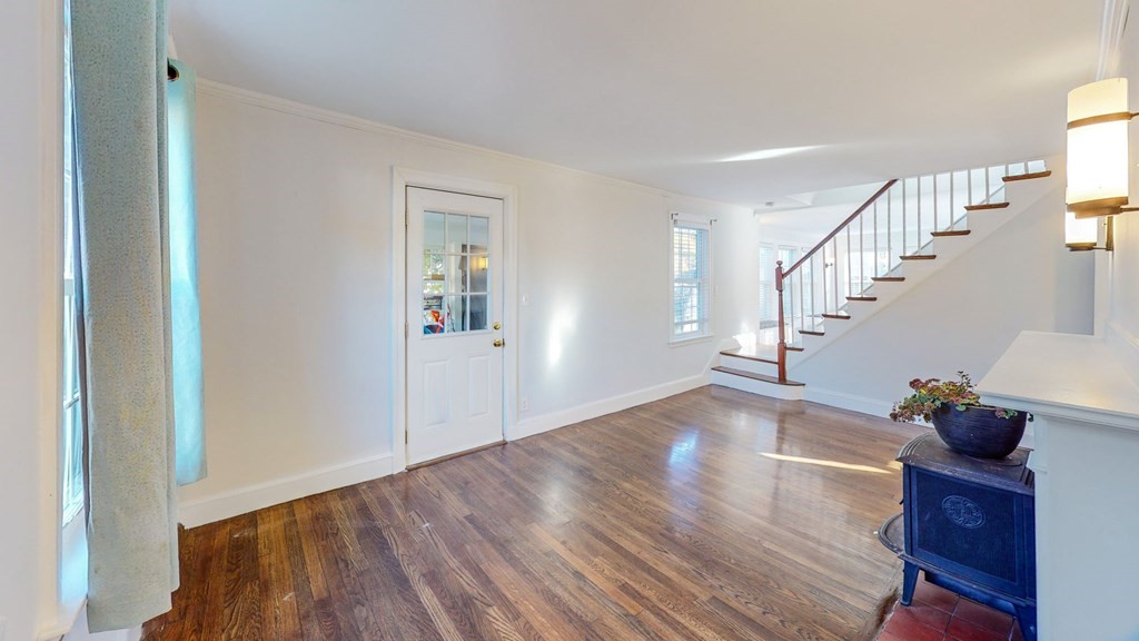 8 Samoset Road Dedham, MA 02026 - Photo 11 of 35 a view of entryway and hall with wooden floor