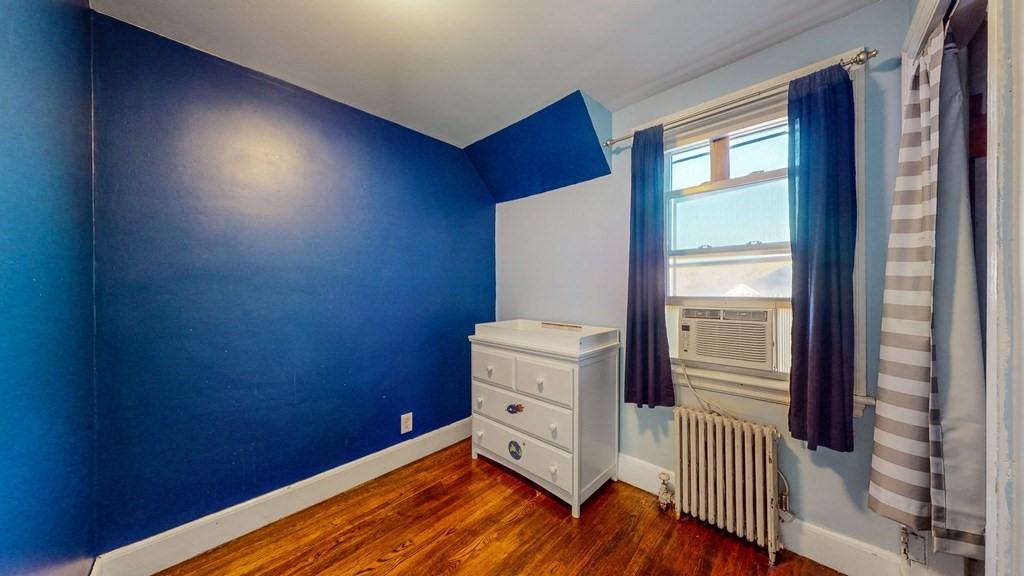 8 Samoset Road Dedham, MA 02026 - Photo 15 of 35 a room with a chair and a dresser