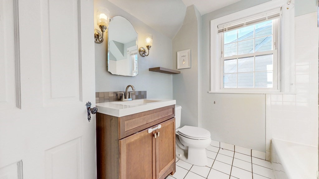 8 Samoset Road Dedham, MA 02026 - Photo 16 of 35 a bathroom with a sink toilet and mirror