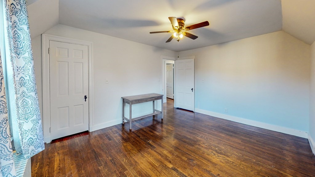 8 Samoset Road Dedham, MA 02026 - Photo 20 of 35 a view of a livingroom with wooden floor and a ceiling fan
