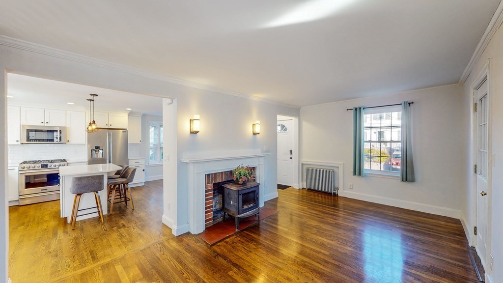 8 Samoset Road Dedham, MA 02026 - Photo 5 of 35 a living room with furniture and a fireplace