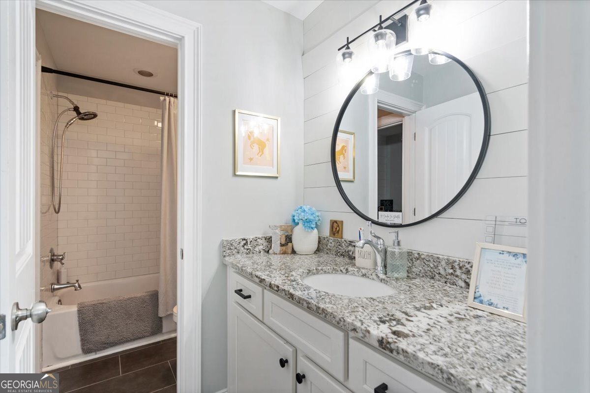 3093 Surry Ridge Drive Watkinsville, GA 30677 - Photo 26 of 41 a bathroom with a granite countertop sink mirror and vanity