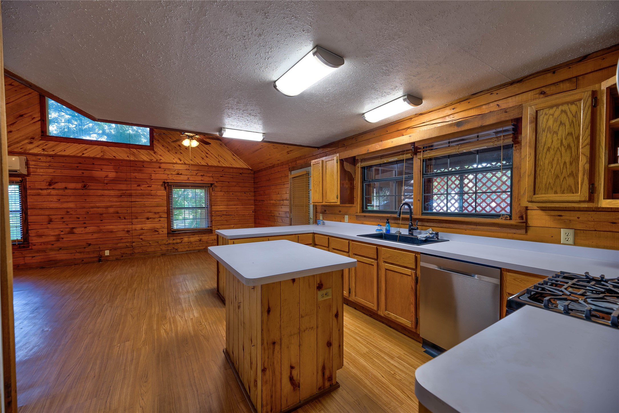 290 Armadillo Road Trinity, TX 75862 - Photo 16 of 28 a kitchen with a sink cabinets and wooden floor