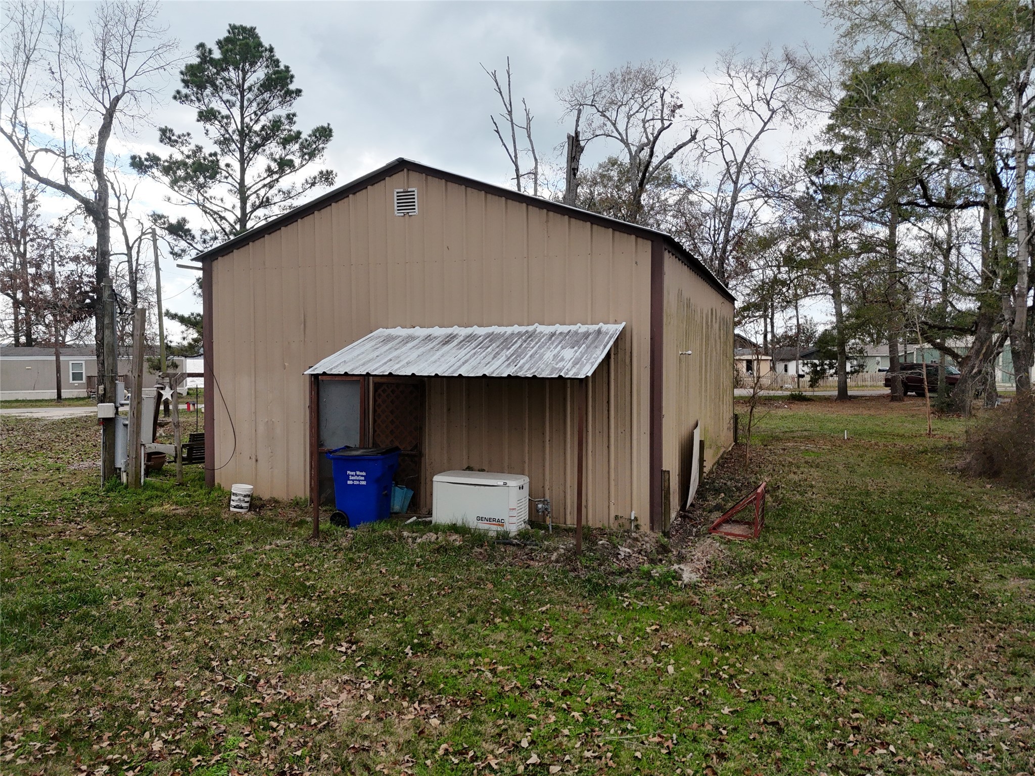 290 Armadillo Road Trinity, TX 75862 - Photo 8 of 28 a house with green field in front of it
