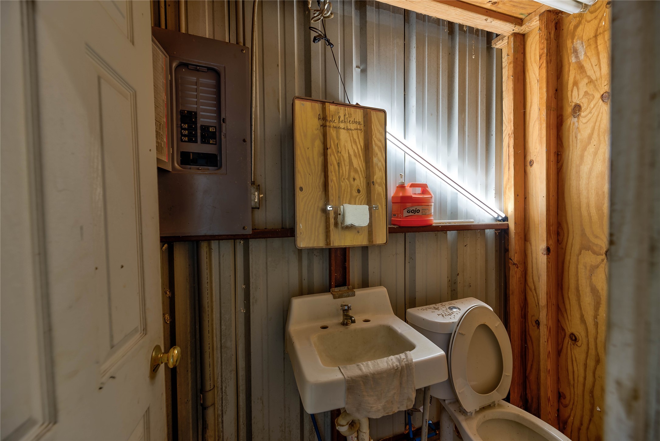 290 Armadillo Road Trinity, TX 75862 - Photo 9 of 28 a bathroom with a sink and mirror