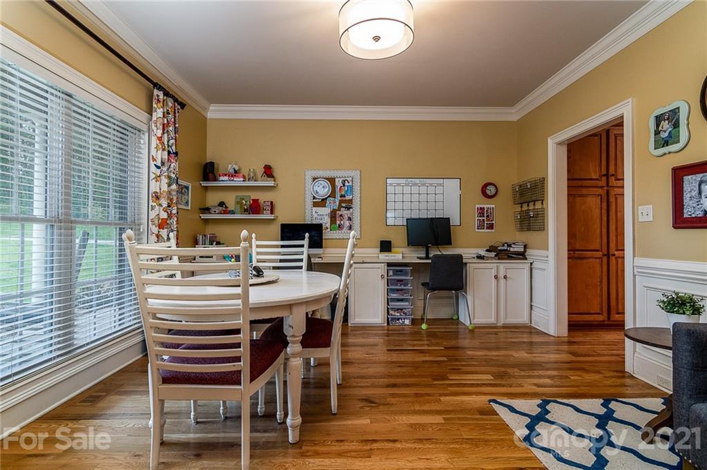 5103 King Wilkinson Road Denver, NC 28037 - Photo 22 of 48 a view of a dining room with furniture window and wooden floor