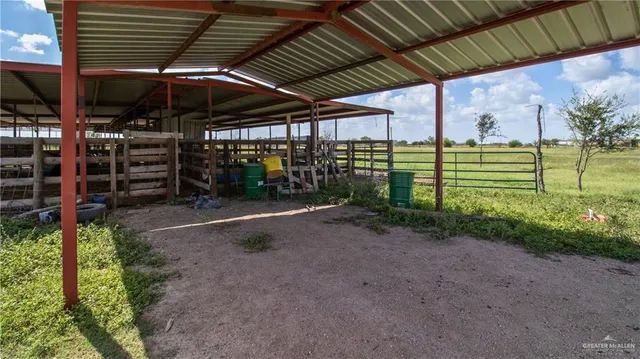 a view of a patio with a table and chairs