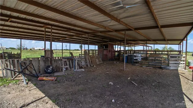 a view of a swimming pool with an outdoor seating