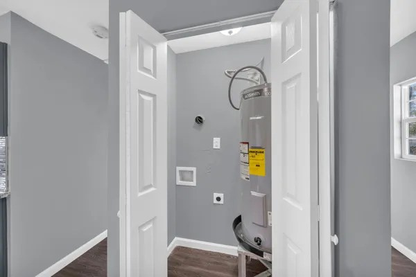 a bathroom with a sink mirror and vanity