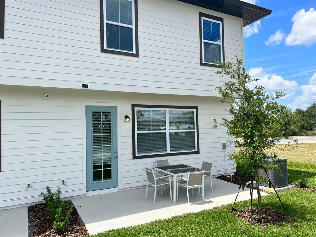955 Conch Road Davenport, FL 33896 - Photo 17 of 20 a wooden bench sitting in front of a house