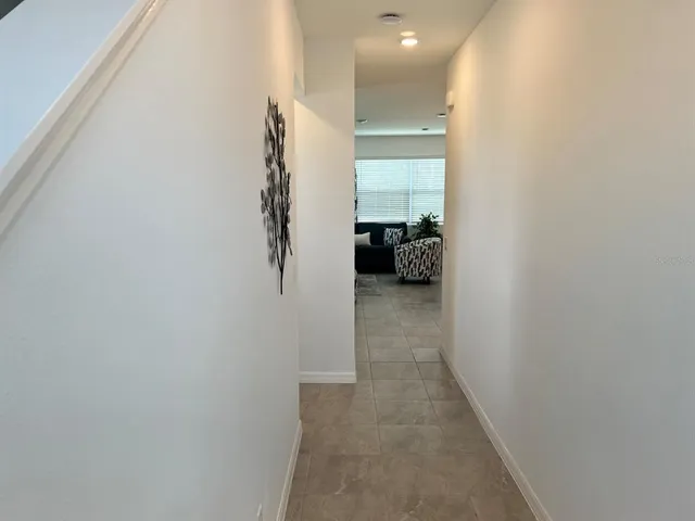 a view of hallway with livingroom
